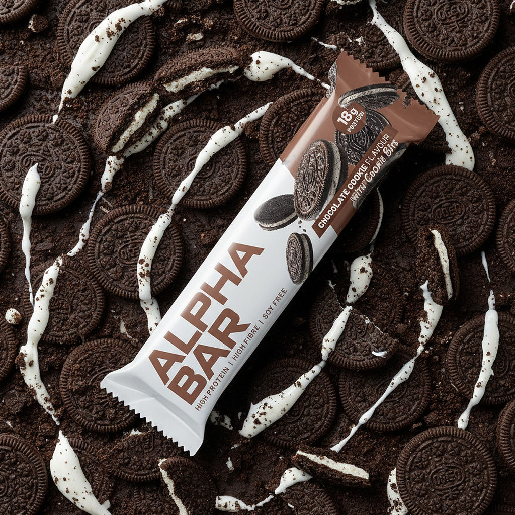 Alpha Bar chocolate cookie crunch bar on a bed of cookies and cream