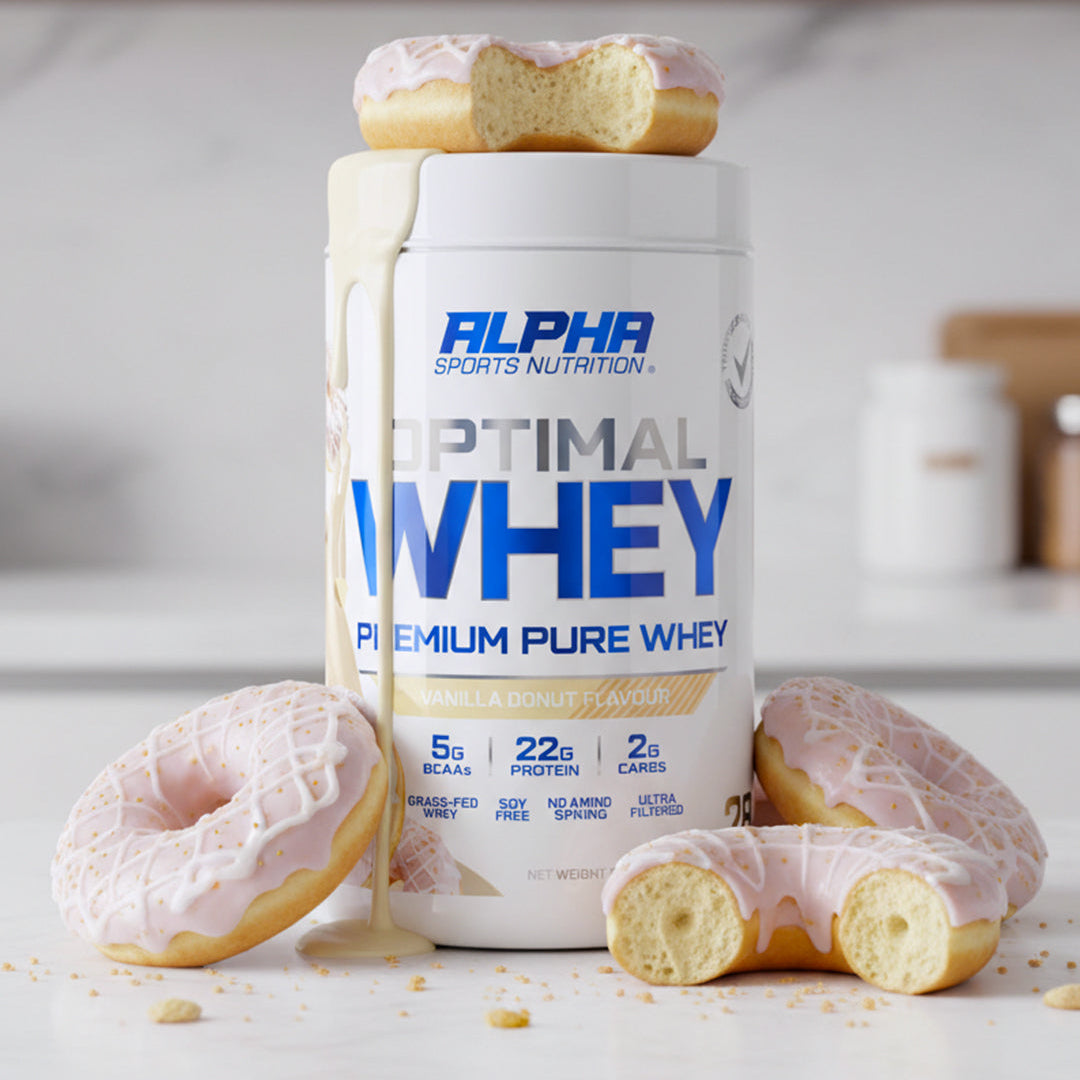 Alpha Sports Nutrition Optimal Whey protein container with donuts on a kitchen counter.